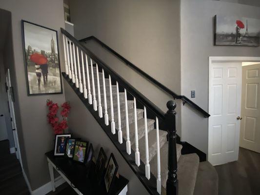 Painted stair rail, walls, and front door.!