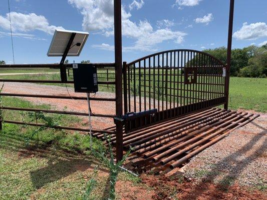 Solar gate arm install after the rain finally cleared enough to let us work.