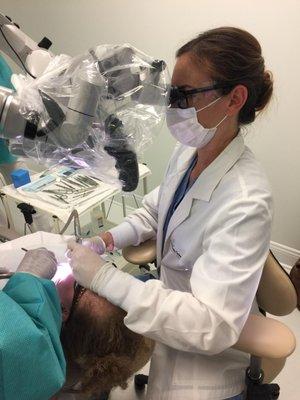 Dr. Vivian Click performing endodontic surgery.