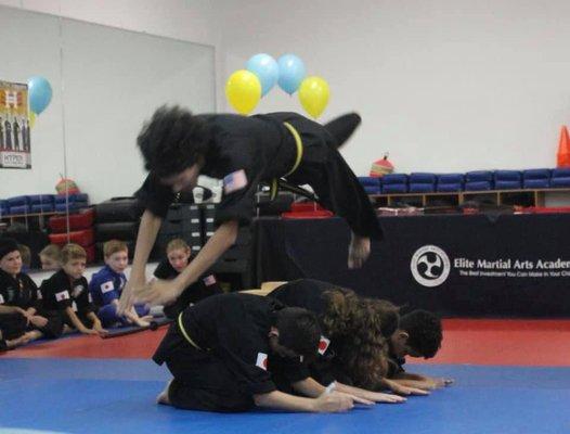 Dive Roll over fellow Karate students!