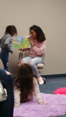 My daughter reading with wonderful staff member of Child Care Links