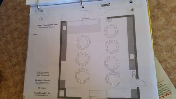 Room c default layout with round tables.  Seats 70 persons.