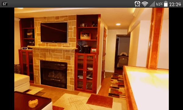 Basement Remodel with custom entertainment center, fireplace