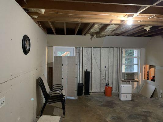 Original unfinished area that was divided into kitchenette and bathroom.