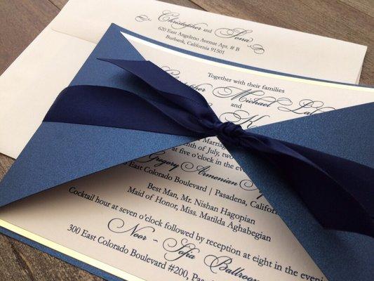 Royal blue wrap with ivory gold foil rim wedding invitations.