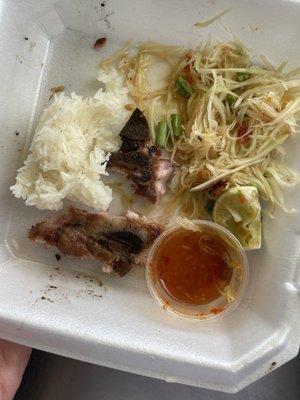 Lao Locos Bbq Pork plate with sticky rice and papaya salad.