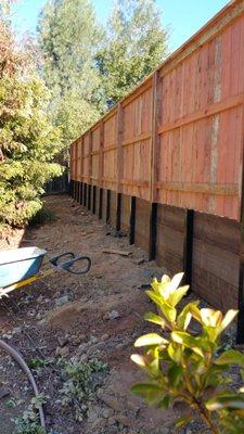 Steel post retaining wall systems.