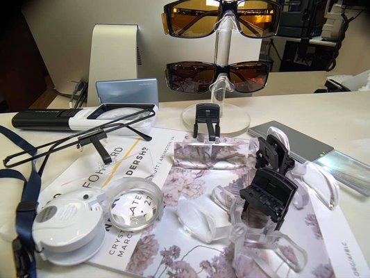 We offer a variety of low-vision magnifiers, optical filters, and assist devices.