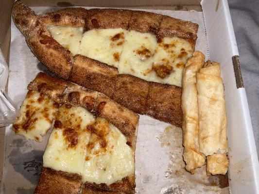 The left: pide with cheese. Right: cigarette borek.