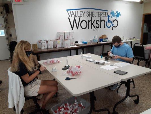 Valley Sheltered Workshop employees completing hand projects