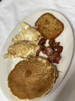 Pancakes, eggs, hash brown, bacon