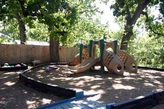 The playground!  In the summer, the kids also do water play here.  Sprinklers galore!