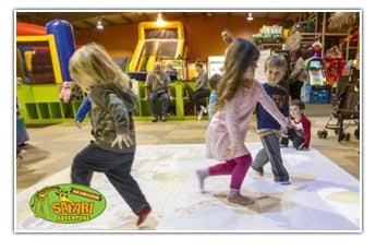 Young children love to play with video interactives games at Safari Adventure Long Island NY