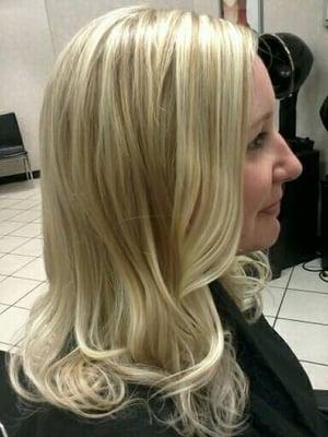 A heavy Hi-light brought up to a  platinum blonde.
 Long layer cut