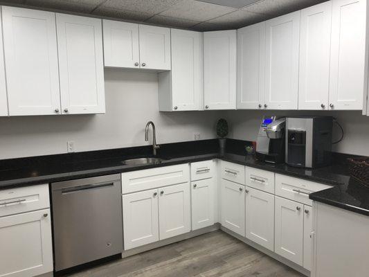 One of our kitchens with filtered hot/cold water; fridge; snacks and beverages.