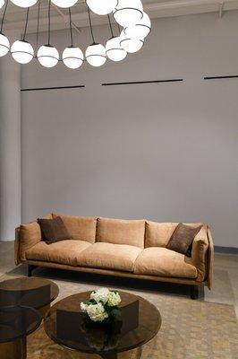 Featuring Wendelbo Kite Sofa, Wendelbo Arc Coffee Tables, and Astep Model 2109 Chandelier