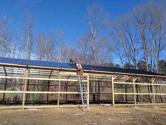 Building a detached building that will also be a garage. This was early in the erection of the metal building, but it was almost under roof!