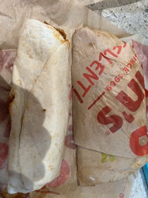 $5 "super burrito" next to a $2.50 regular burrito (same size).