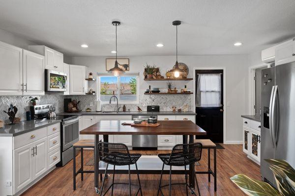 Open floorpan kitchen in Joshua Tree, CA. Home Buzz Staging & Redesign. Boho Desert Eclectic.