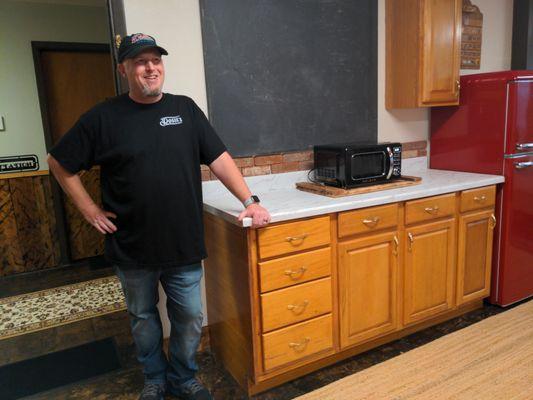 "Wilcox" Room #8 . GM, Will, beside a portion of the chalkboard, repurposed from a nearby One Room School House.