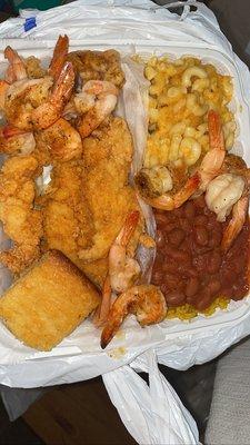 Catfish,broiled shrimps,Mac and cheese,yellow rice and beans,corn bread.