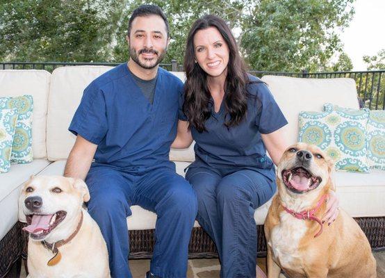 Drs. Sara and Ali Golshani with their furry kids, Brees and Bailey.