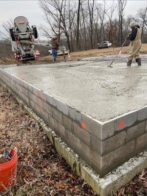 Tune Concrete with a Crew working on a slab.