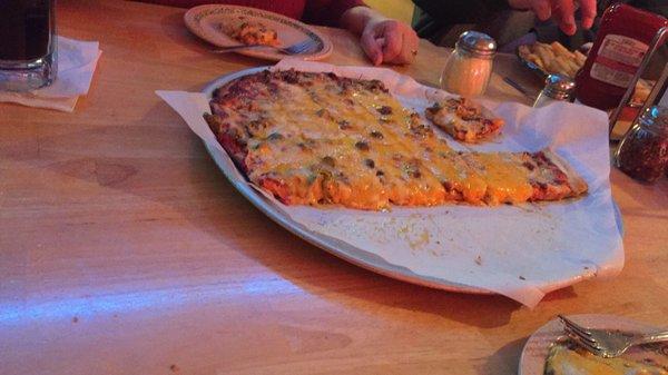 Large taco meat, green olive, and cheddar pizza.