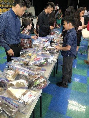 The kids preparing the bags for you he needy