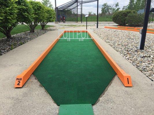 Hole #1, batting cages in the background