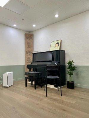 Music instruction room with a high end Yamaha Upright piano.