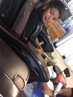 My son getting his first spa pedicure they did a great job on his feet