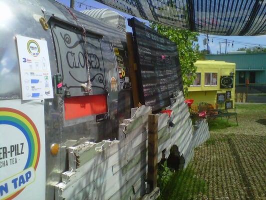 Arty shot of Vegan Yacht with Eat Trailer in the background