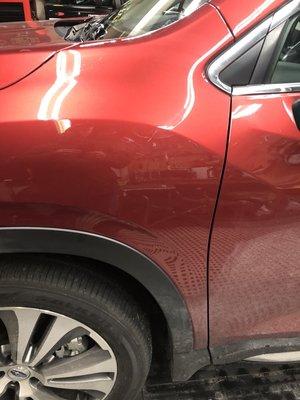 Suburu fender dent after