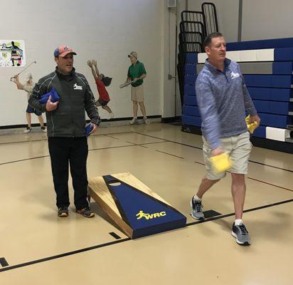 WRC staff members enjoying a game of cornhole on the new WRC Cornhole Boards