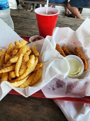 Chicken tenders and a basket of fries