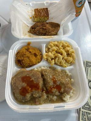 Smothered and fried Pork Chops on white rice, with sweet potato and mac n cheese