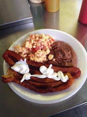 Fried Plantains with Sour Cream accompanied by Scrambled Eggs and Beans