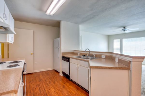 Kitchen with White Appliances and Double Basin Sink