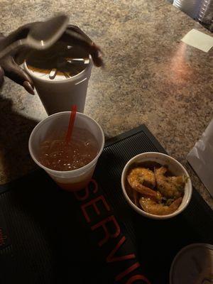 An order pepper shrimp, fish soup and rum punch