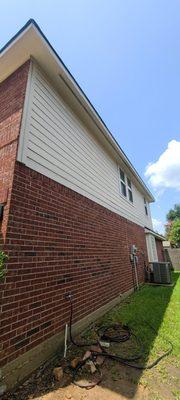 The Algae has been eliminated from siding and brick wall