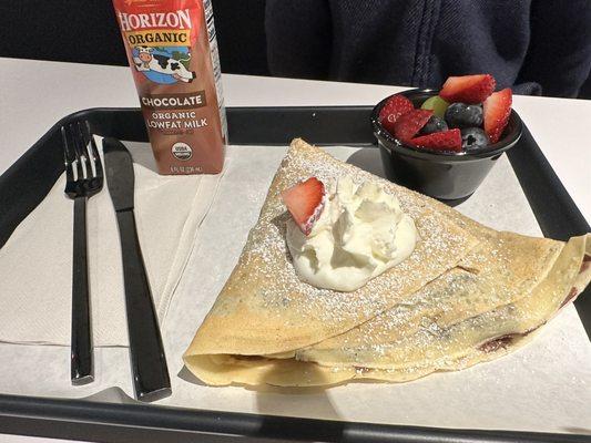 Kids fruit and Nutella crepe with a side of fruit cup.