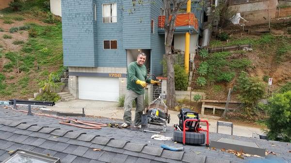 Clearing a drain line from a roof vent