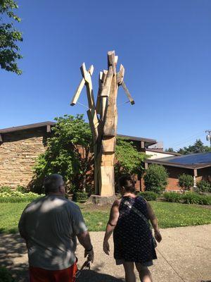 Tree turned into wooden pliers out front