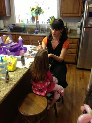 A face painter at a birthday party