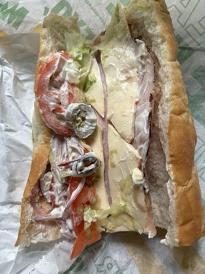 Double ham and cheese with lettuce tomato extra onions olives and jalapeños with mayo. Only thing they got right is the mayo.