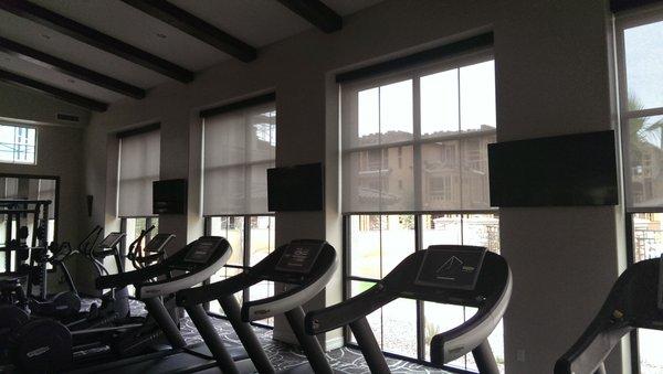 TV's in an exercise room for an apartment complex