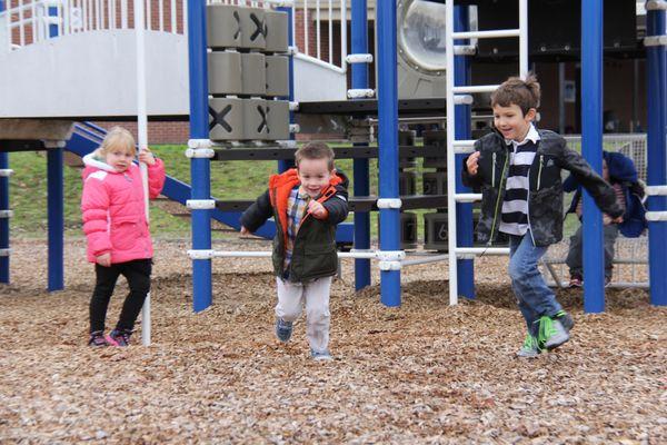 Little Blessings preschoolers run off energy outside.