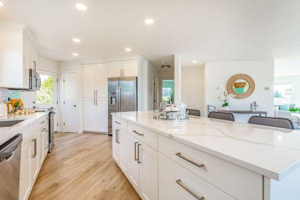 Breathtaking kitchen remodel with sleek countertops and ample storage. Contact us to start your own dream kitchen project