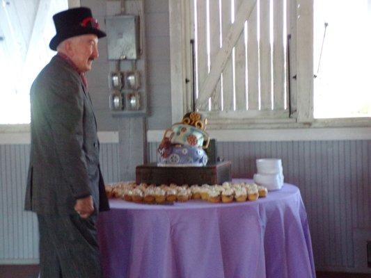 $1000 wedding cake leaning over.